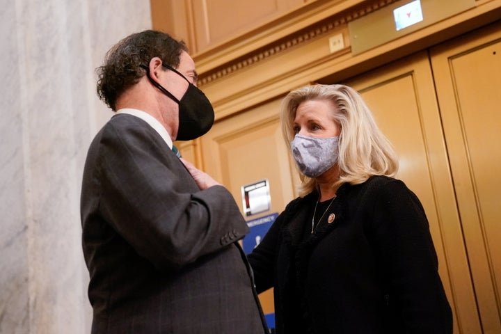 Rep. Jamie Raskin (D-MD) talks with Rep. Liz Cheney (R-WY) in the U.S. Capitol after the House voted on a resolution demandin