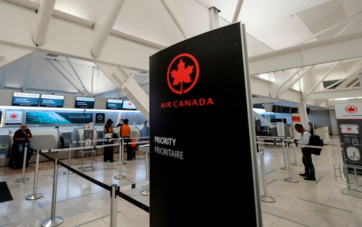 The Air Canada hall at Benito Juarez International Airport, Mexico City, May 20, 2020. Air Canada says it will cut 1,700 jobs as it scales down operations in response to a new wave of lockdown restrictions.