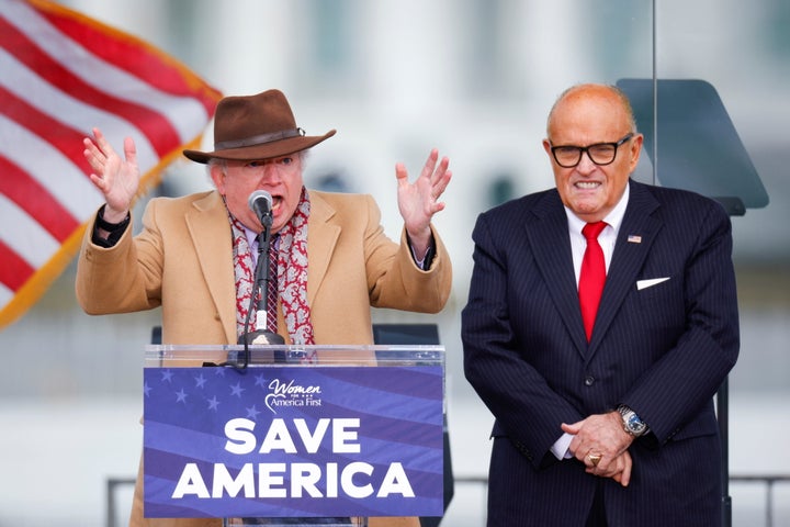 Chapman University law professor John Eastman, next to Rudy Giuliani, gestures as he speaks to Trump supporters in Washington on Jan. 6.