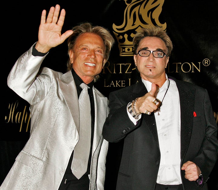 Siegfried Fischbacher, left, and Roy Horn, right, pictured at Elizabeth Taylor's 75th birthday party in 2007.