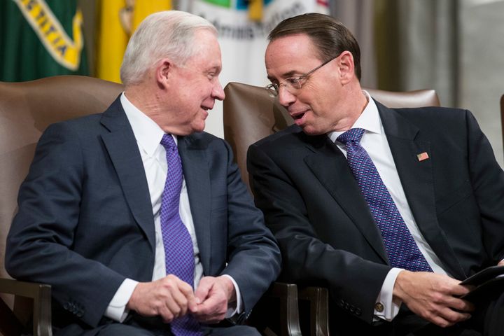 Then-Attorney General Jeff Sessions (left) and then-deputy Attorney General Rod Rosenstein talk during an event in Washington in 2018. Sessions was a top advocate of the family-separation policy during the Trump administration. (AP Photo/Alex Brandon)