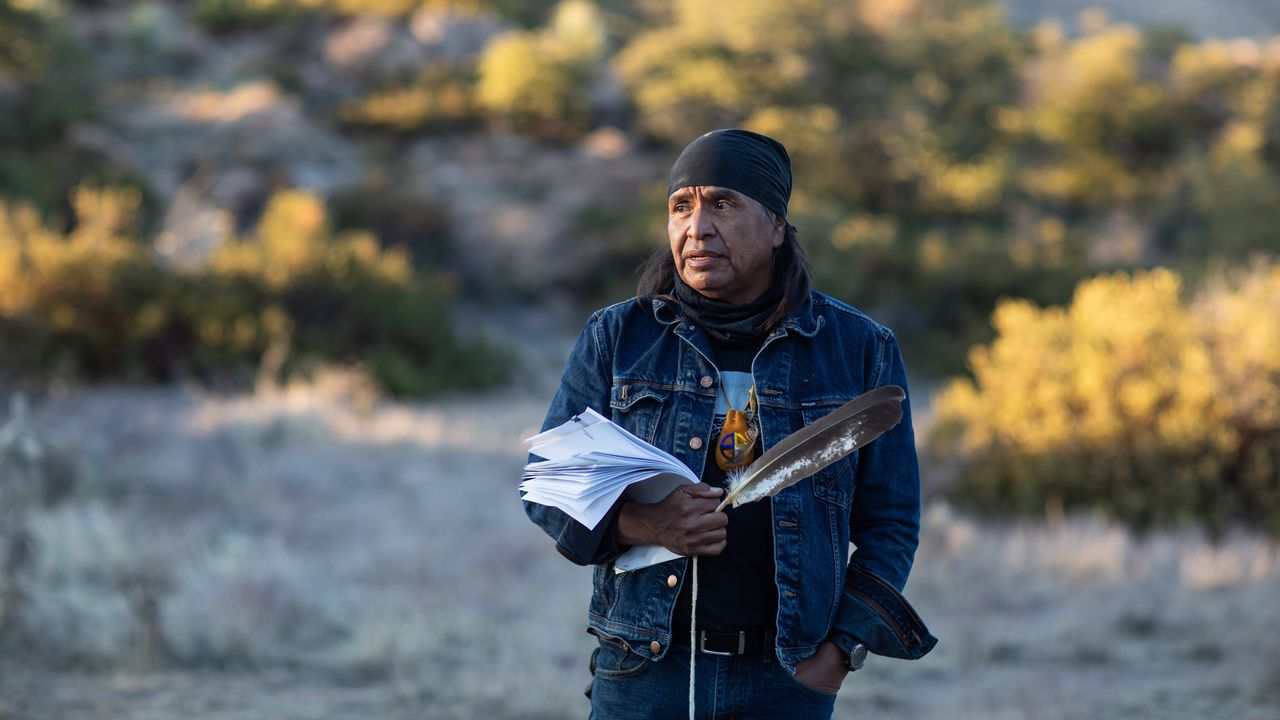 OAK FLAT, AZ - Jan. 10, 2021: Former San Carlos Apache Chairman Dr. Wendsler Nosie addresses Apache Stronghold on January 10, 2021. They have long been fighting mining conglomerate Rio Tinto and their subsidiary Resolution Copperâs proposal to build a copper mine on sacred Apache land. Nosie holds a paper copy of the new lawsuit filed January 12 against the Trump administration which was prayed over by elders and medicine people at a ceremony on January 10. 