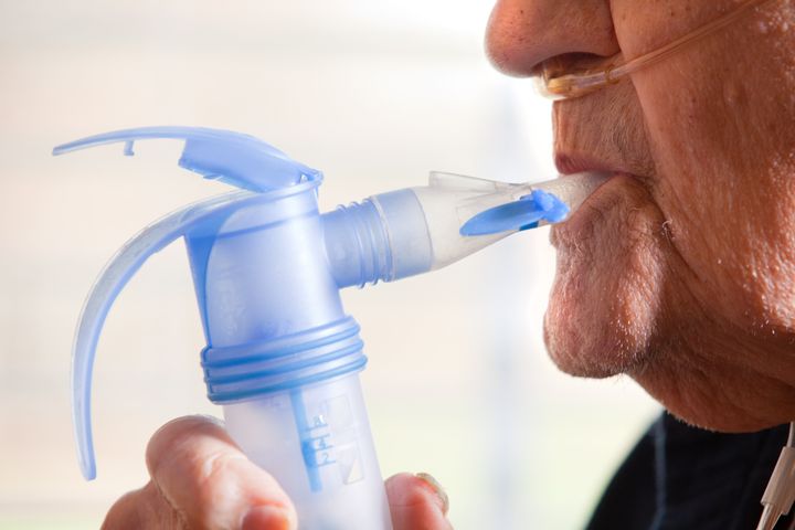 A stock image of a man using a nebuliser, similar to the type to be used in the trial. 