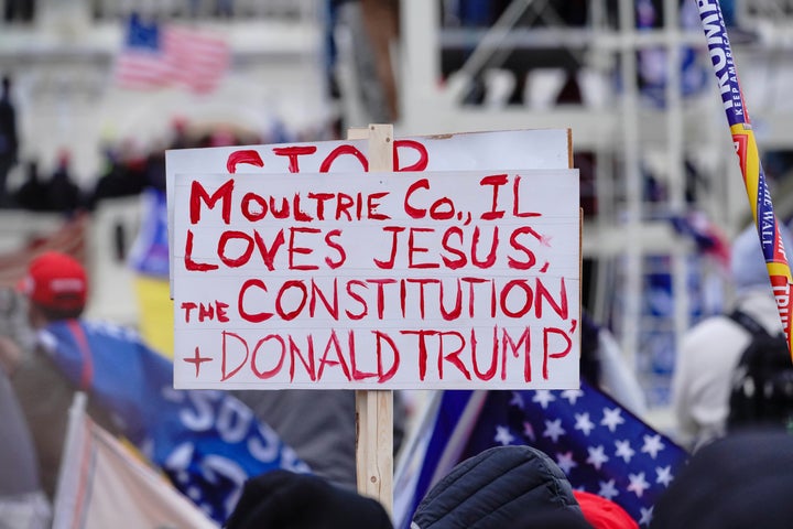 A sign referencing Jesus is held aloft during a "Stop the Steal" rally in support of President Donald Trump in Washington, D.C., on Jan. 6.