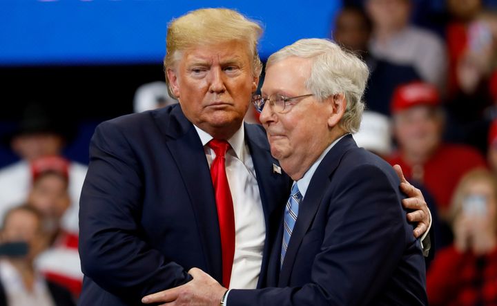 Mitch McConnell hugs Donald Trump in happier times. 