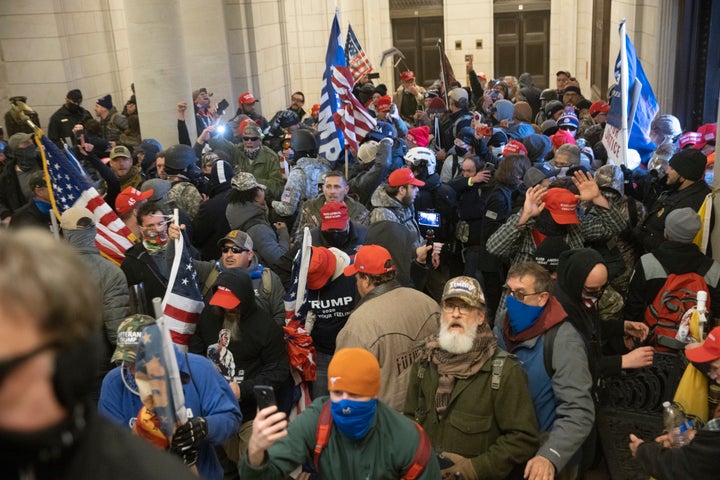 Trump supporters gather near the east front door of the U.S. Capitol after groups breached the building's security on Jan. 6, 2021.