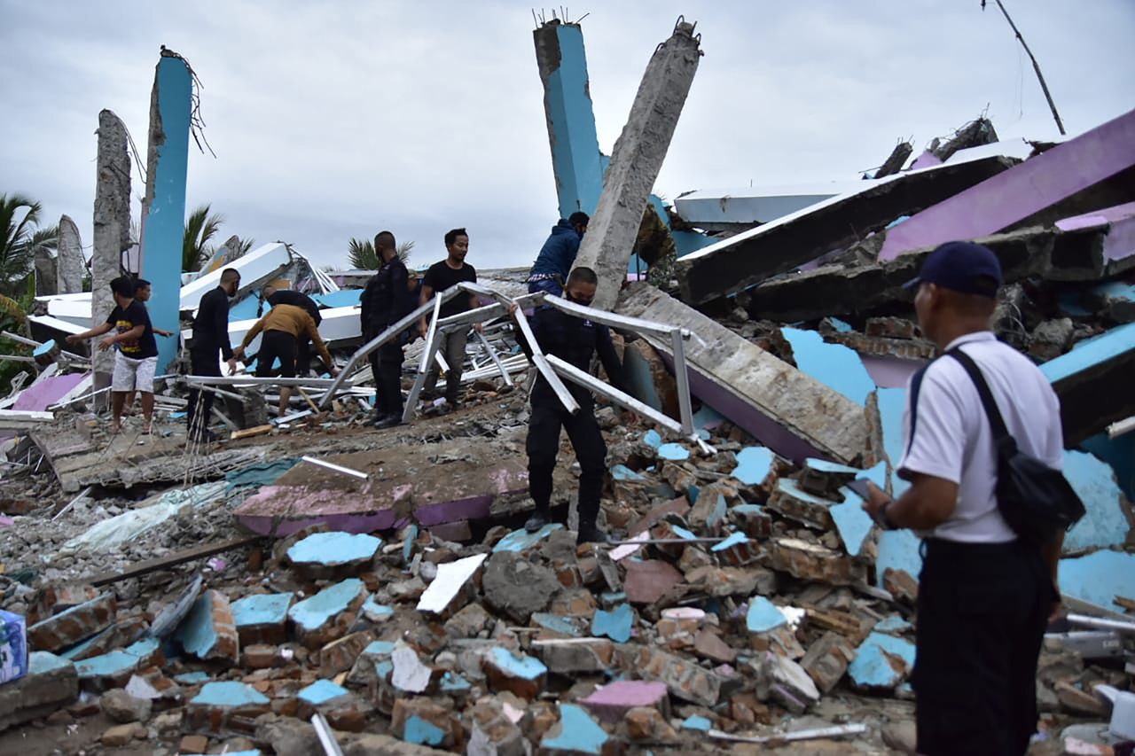 As many as 20 patients and staff are trapped beneath the rubble the Mitra Manakarra hospital in Mamuju city was flattened by an earthquake