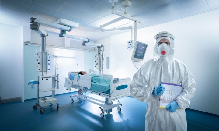 A nurse wears protective gear in an intensive care unit during the Covid-19 global pandemic