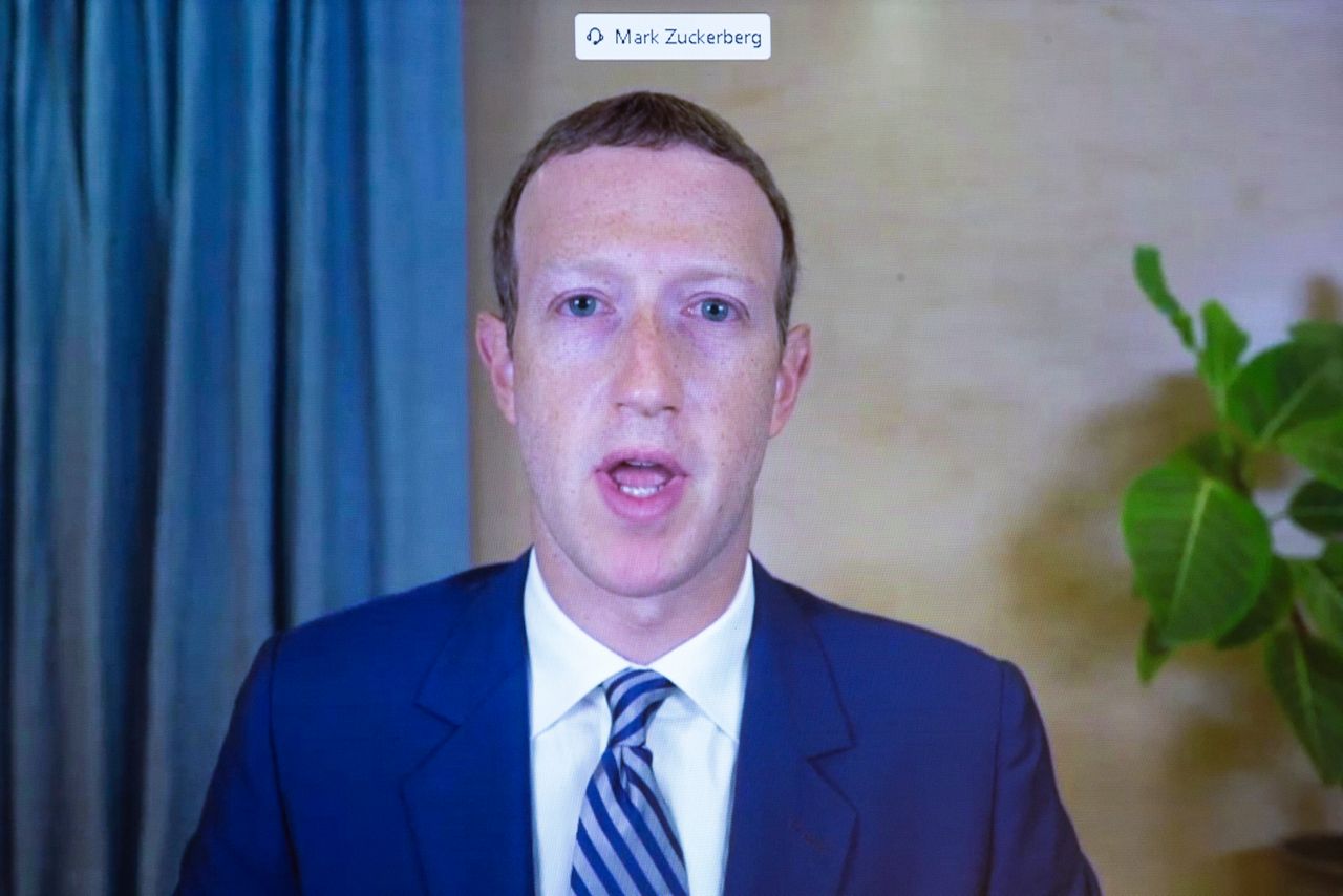 Facebook CEO Mark Zuckerberg appears on a screen as he speaks remotely during a hearing before the Senate Commerce Committee.