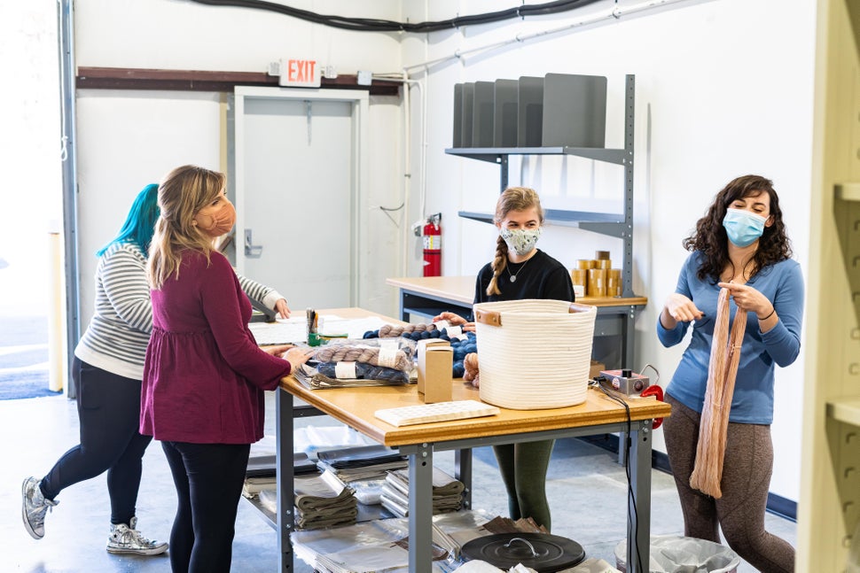 Ashleigh and Brooke Kiser prepare January's orders with their staff.