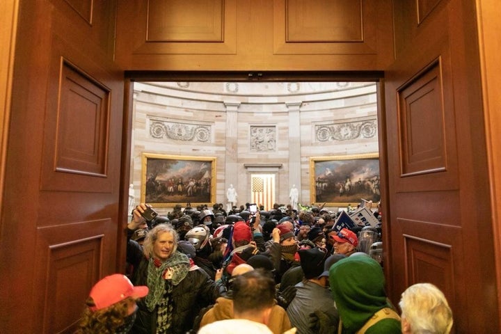 Pro-Trump insurrectionists storm the Capitol after President Donald Trump told them to march on the building to stop Congress from certifying President-elect Joe Biden's win. 