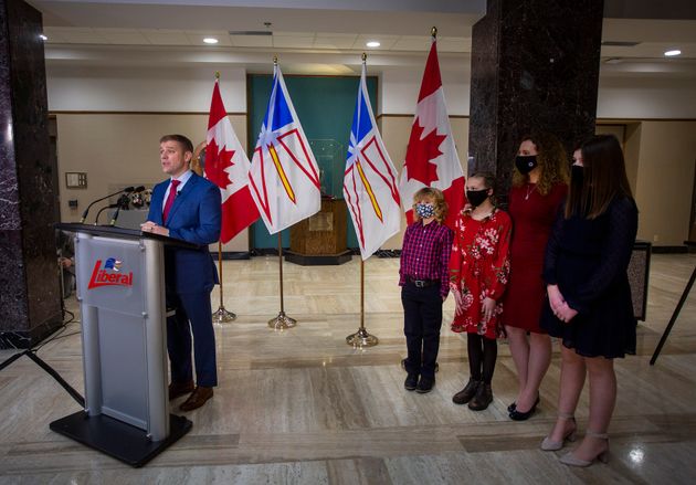 Newfoundland and Labrador Premier Andrew Furey supported by his wife Dr. Allison Furey and their children,...