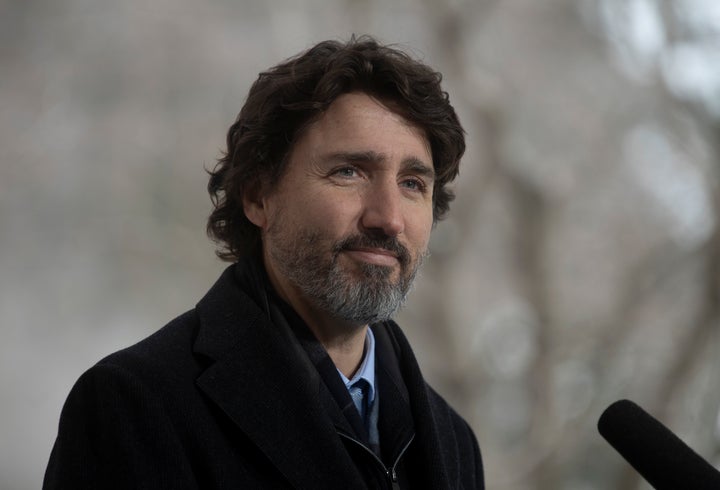 Prime Minister Justin Trudeau listens to a question from a reporter during a news conference outside Rideau Cottage in Ottawa on Friday.