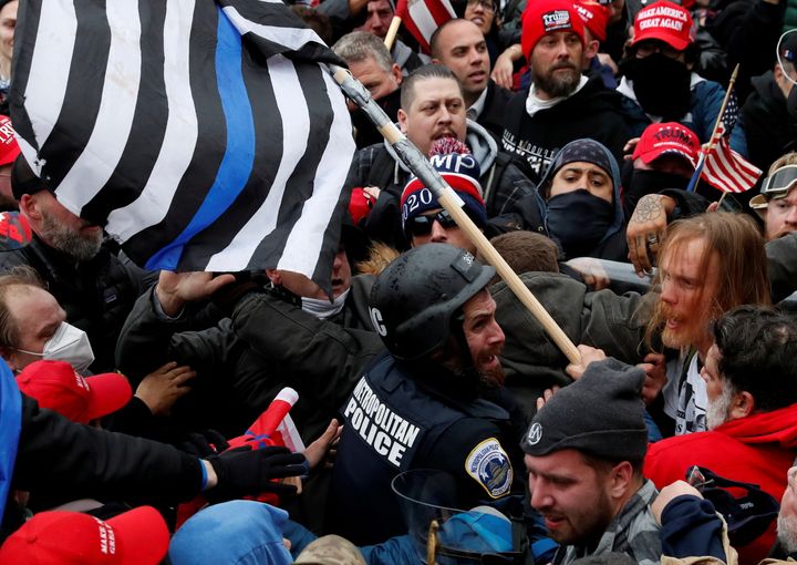 Pro-Trump protesters clash with D.C. police officer Michael Fanone at a rally to contest the certification of the 2020 presidential election results by Congress on Jan. 6.