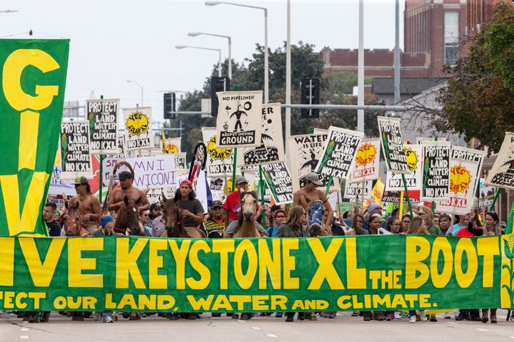 In this Aug. 6, 2017, file photo, demonstrators against the Keystone XL pipeline march in Lincoln, Neb.