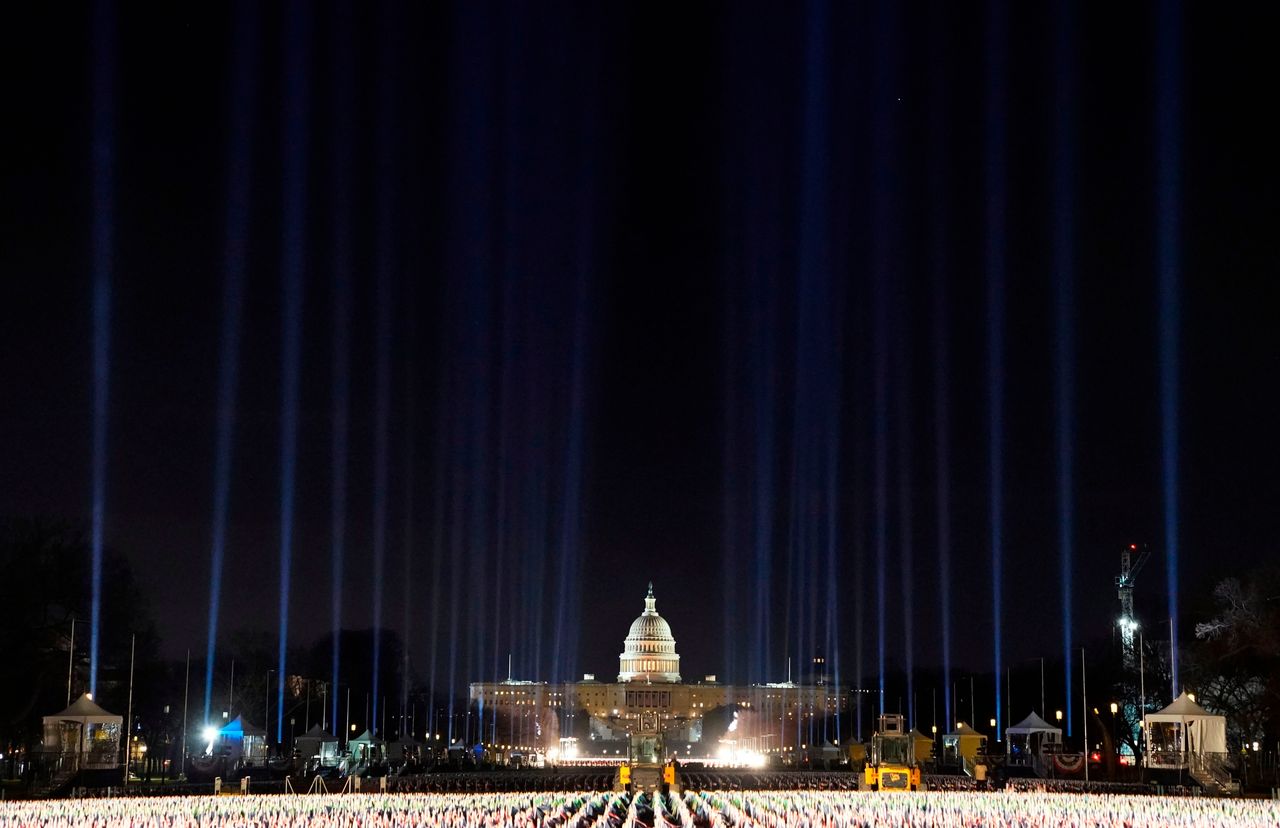 Lights were beamed into the sky surrounding the "Field of Flags" as inauguration week kicked off Monday.