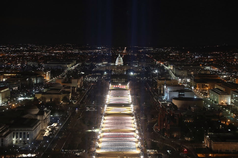 Pillars of light representing each U.S. state and territory light up the flag display.