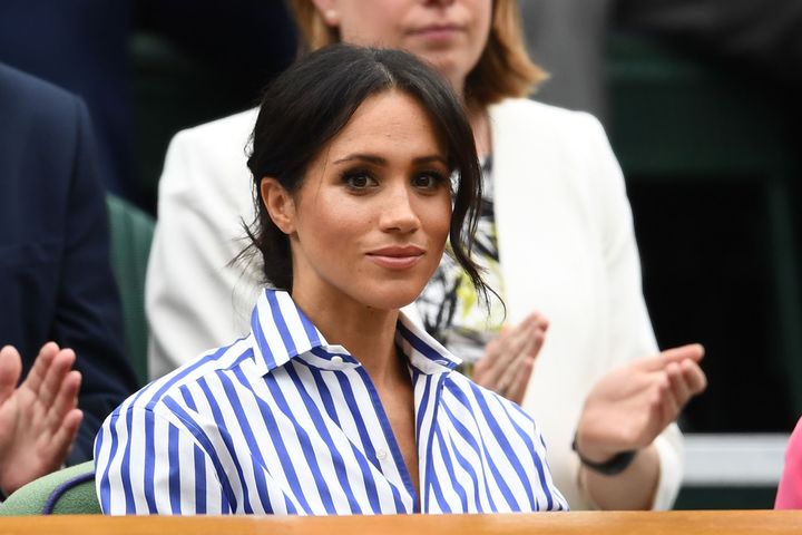The Duchess of Sussex attends day twelve of the Wimbledon Lawn Tennis Championships on July 14, 2018 in London.