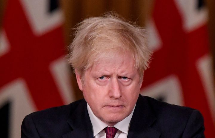 Prime Minister Boris Johnson looks on during a news conference in response to the ongoing situation with the coronavirus disease (COVID-19)
