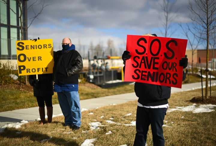 People protest outside the Tendercare Living Centre long-term-care facility during the COVID-19 pandemic in Scarborough, Ont., on Dec. 29, 2020. This LTC home has been hit hard by the coronavirus during the second wave.