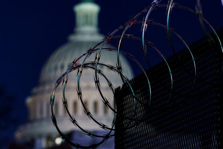 Riot fencing and razor wire reinforce the security zone on Capitol Hill in Washington on Tuesday, the day before Joe Biden's inauguration.