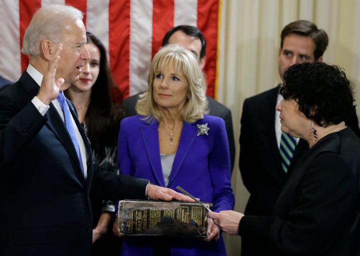 Jill Biden holds the Biden family Bible as then-Vice President Joe Biden takes the oath of office on Jan. 20, 2013, in Washin