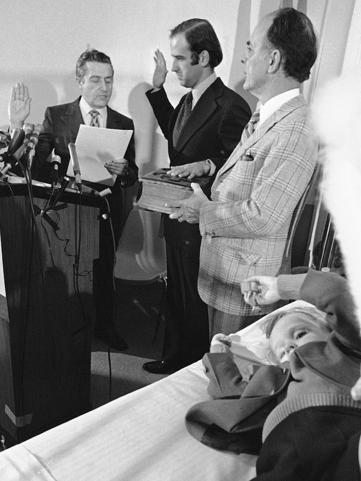 Joe Biden (center) is sworn in as a senator from Delaware at a Wilmington hospital on Jan. 5, 1973. Four-year-old Beau Biden (foreground) was injured in an accident that killed his mother and sister a week before Christmas. His 2-year-old brother, Hunter, was also injured.