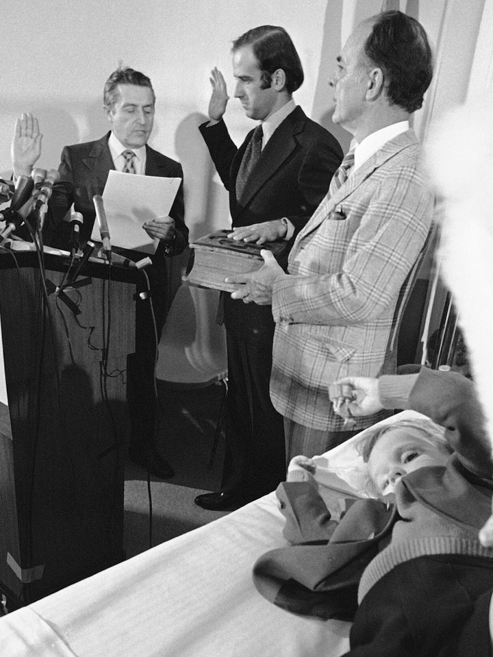 Joe Biden (center) is sworn in as a senator from Delaware at a Wilmington hospital on Jan. 5, 1973. Four-year-old Beau Biden (foreground) was injured in an accident that killed his mother and sister a week before Christmas. His 2-year-old brother, Hunter, was also injured.