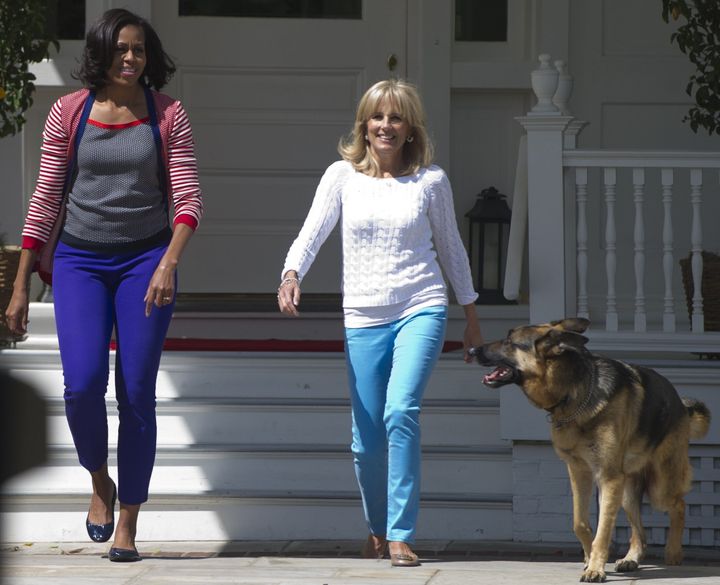Michelle Obama, Jill Biden and Champ arrive to help assemble Mother's Day packages that deployed U.S. troops requested to be sent to their mothers and wives at home at the Naval Observatory in May 2012.