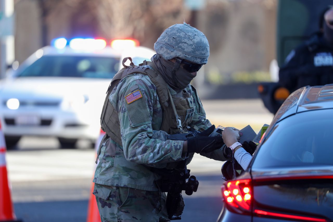 Police and National Guard soldiers at a checkpoint near the U.S. Capitol Building on Tuesday.