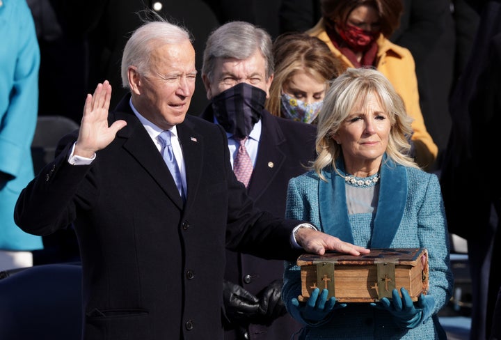 Joe Biden is sworn in as U.S. President as his wife Dr. Jill Biden looks on during his inauguration on the West Front of the U.S. Capitol on January 20, 2021 in Washington, DC. During today's inauguration ceremony Joe Biden becomes the 46th president of the United States. (Photo by Alex Wong/Getty Images)