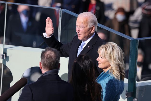 Joe Biden is sworn in as US president as his wife Dr Jill Biden looks on during his inauguration on the West Front of the US Capitol