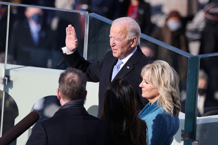 Joe Biden is sworn in as US president as his wife Dr Jill Biden looks on during his inauguration on the West Front of the US Capitol