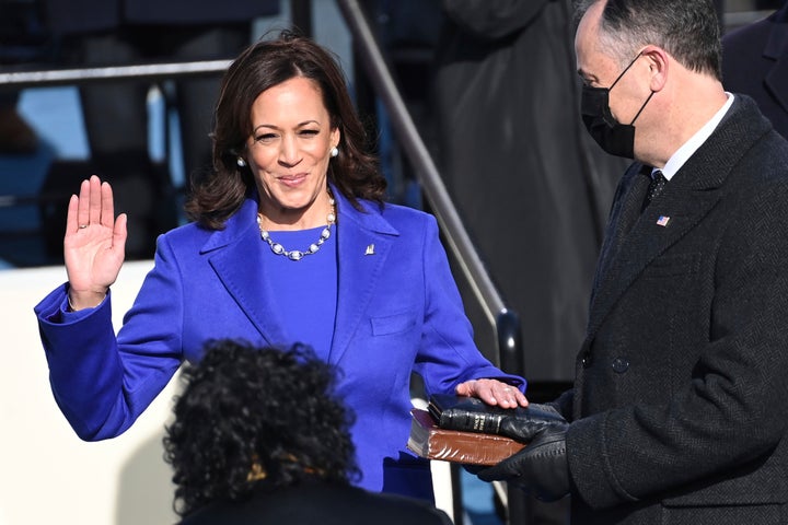 Kamala Harris is sworn in as vice president as her husband, Doug Emhoff, holds the Bible at the U.S. Capitol on Jan. 20, 2021.