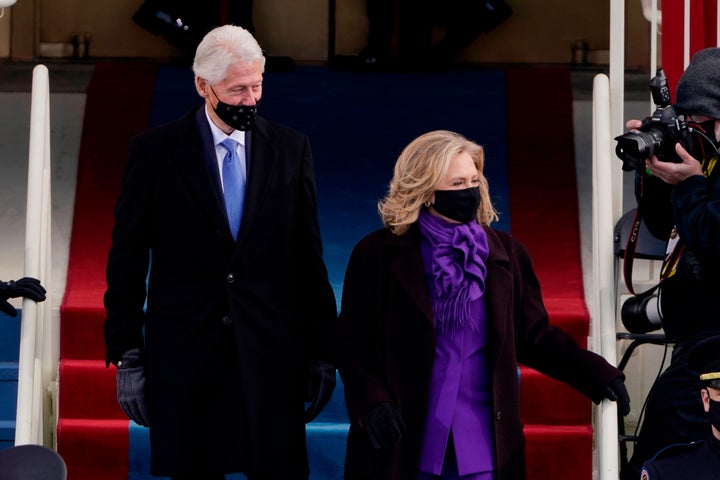 Former US President Bill Clinton arrives with former Secretary of State Hillary Clinton.