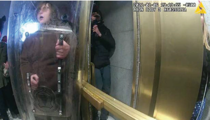 One YouTube video appeared to show McCaughey armed with a riot shield during the insurrection at the U.S. Capitol.