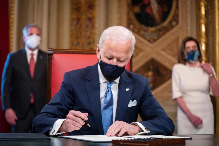 U.S. President Joe Biden signs three documents including an Inauguration declaration, cabinet nominations and sub-cabinet nominations in the President's Room at the U.S. Capitol after being sworn-in as the 46th president of the United States on Jan. 20, 2021.