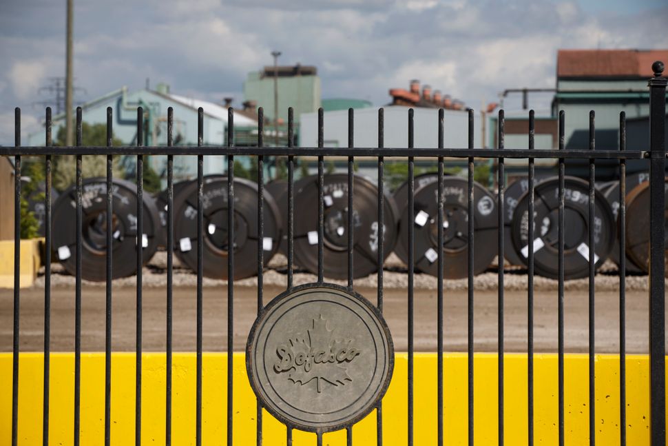  Steel coils are lined up behind the fence at the ArcelorMittal Dofasco steel plant on June 4, 2018 in Hamilton Ont.