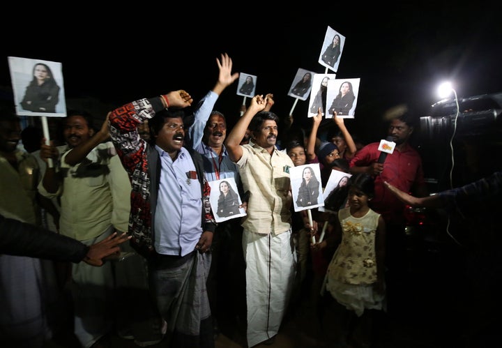 People celebrate in the village of Thulasendrapuram after Kamala Harris was sworn in as U.S. Vice President, on January 20, 2