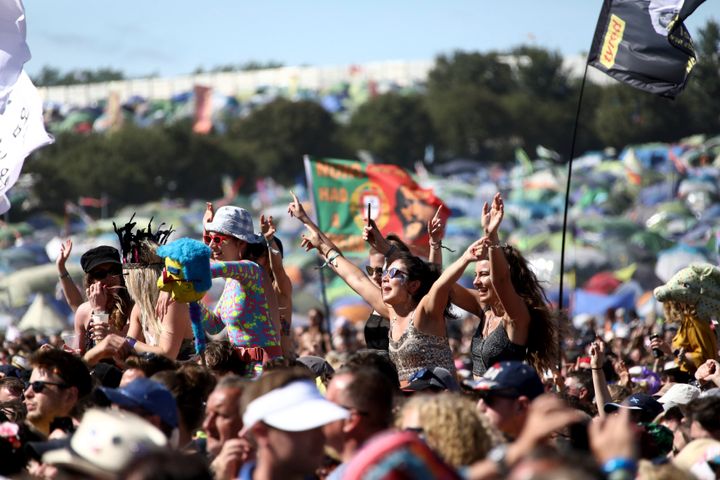 Festival-goers watch Kylie Minogue at the Glastonbury Festival