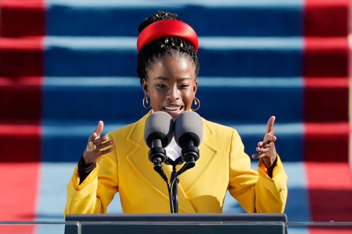 Amanda Gorman recites her poem, “The Hill We Climb," in a Prada coat and headband during Wednesday's inauguration ceremony.