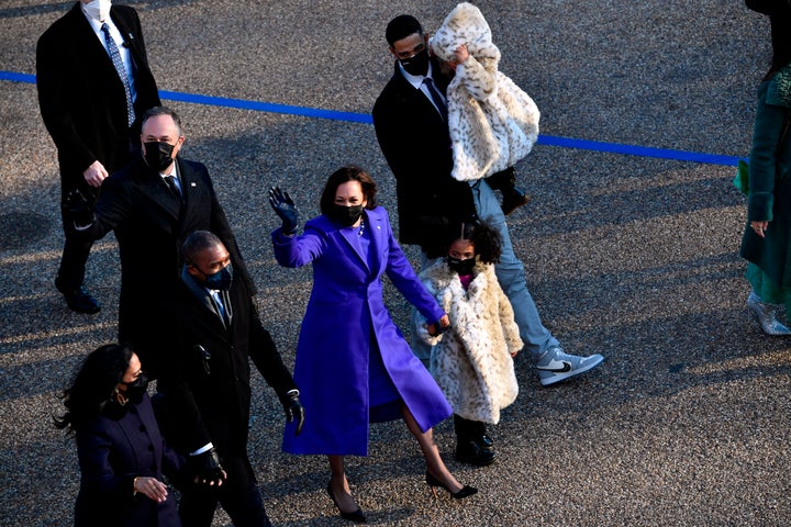 Vice President Kamala Harris walks with her family, including her niece's husband Nikolas Ajagu, during Wednesday's brief inaugural parade.