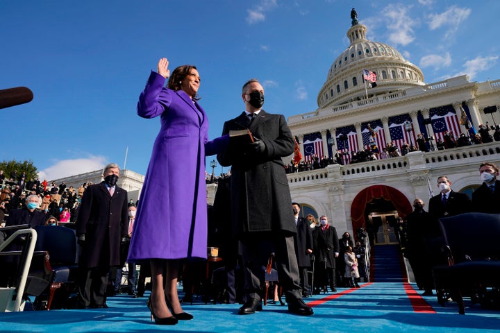 Harris and Emhoff are pictured as she is sworn in as vice president by Supreme Court Justice Sonia Sotomayor.