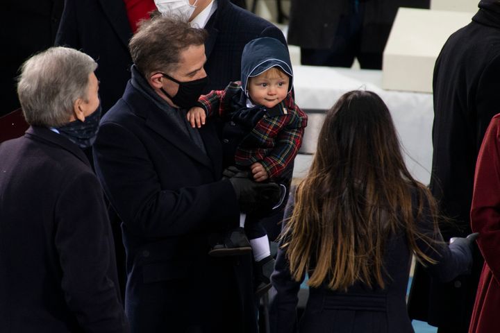 Hunter Biden holds his son, Beau, at the inauguration.