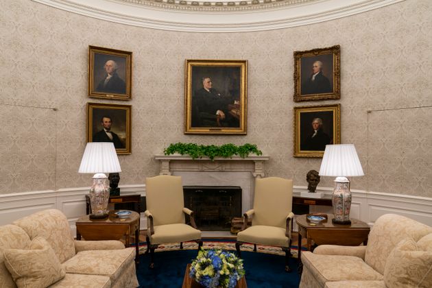 Portraits of former presidents Franklin D. Roosevelt, Abraham Lincoln, George Washington and Thomas Jefferson, and treasury secretary Alexander Hamilton are seen in president Joe Biden's Oval Office.