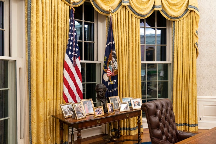 A bust of Cesar Chavez sits on a credenza behind the Resolute Desk in Joe Biden's Oval Office.