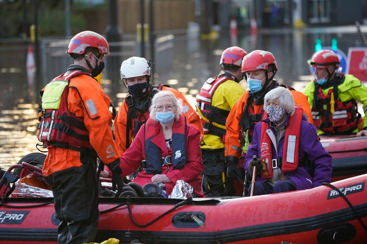NORTHWICH, ENGLAND - JANUARY 21: Elderly residents are evacuated from a local care home by Fire and Rescue emergency services personnel on January 21, 2021 in Northwich, United Kingdom. The first named storm of 2021 has swept across North of England and Scotland bringing flooding and heavy snow. (Photo by Christopher Furlong/Getty Images)