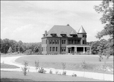 The red brick house was built as the official residence for the superintendent of the Naval Observatory. This photo is from about 1895, before the Observatory roads were paved.