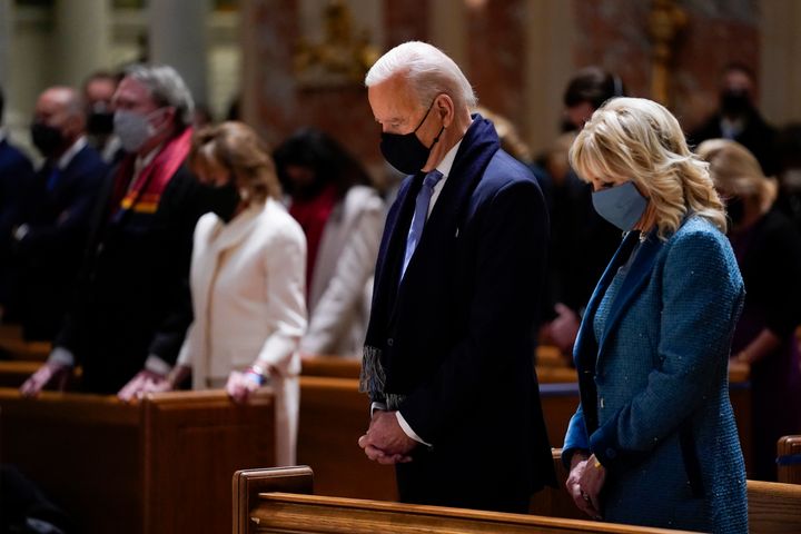 President-elect Joe Biden and his wife, Jill Biden, attend Mass at the Cathedral of St. Matthew the Apostle in Washington before his inauguration Wednesday.