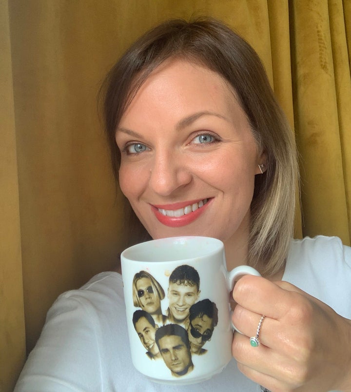 Carly and her favourite mug, which definitely doesn't have tea in it.
